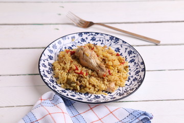 plate of rice with chicken and peppers