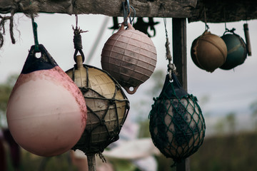 dramatic colorful fishing floats drying © Gustavo