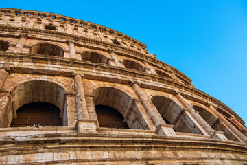 Rome, Italy - External walls of the ancient roman Colosseum - Colosseo - known also as Flavian amphitheater - Anfiteatro Flavio - in an evening light