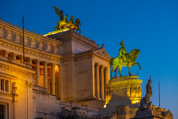 Rome, Italy - Evening view of the Victor Emmanuel II National Monument, known also as Altare della Patria - at the Piazza Venezia square and the Palatine Hill