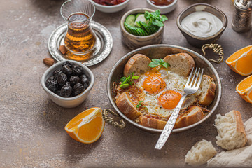 Fried eggs or yumurta in traditional turkish pan