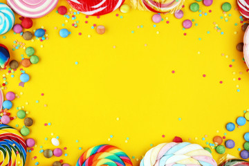 candies with jelly and sugar and streamers. colorful array of different childs sweets and treats.