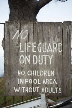 No Lifeguard Wooden Sign At A Pool In Big Sur.