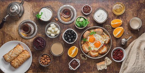 Traditional turkish breakfast with eggs, vegetables and appetizers, flat lay