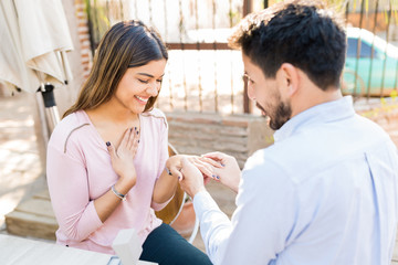 Naklejka premium Man Surprising Girlfriend With Ring