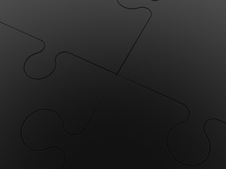 Intersection of puzzle pieces in black close-up