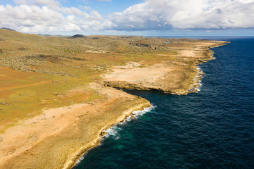 Aerial view of coast of Cura&ccedil;ao in the Caribbean Sea with turquoise water, cliff, beach and beautiful coral reef around Boka Patrick
