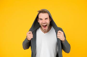 You make me angry. Angry man yellow background. Handsome guy in angry mood. Unshaven model scream...