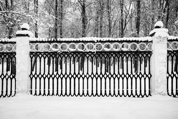 Beautiful Landscape Of Trees With Snow And With Decorative Fences.