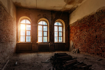 Fototapeta na wymiar Old ruined abandoned mansion interior, vaulted windows