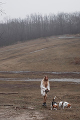 Girl on a walk with dogs in the fall