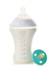 Bottle of milk for baby with pacifier on white background
