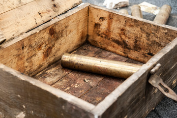 Old ammunition box with big shell