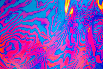 Abstract trendy neon colored psychedelic fluorescent striped zebra textured neon background © Aleksandra Konoplya