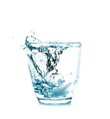 Glass of fresh water with splash on white background
