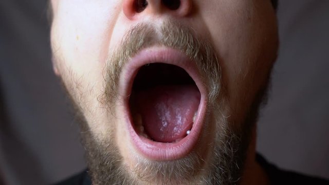 A man yawning in the studio