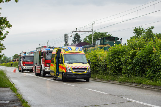 Train Ran Over A Pedestrian, Firemen And Rescue On The Site. Death On A Grade Crossing With Train, Danger Being Hit By A Train. Collision Of Person With A Train, With Police And Emergency Standing By