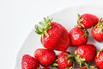 plate with strawberries on a white background