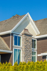 The roof of the house with nice window.