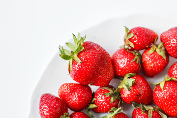 plate with strawberries on a white background