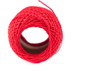 Red thread isolated on white background. Copy space.
