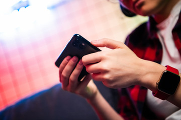 Closeup of Teenager Playing videogames On Mobile phone. Shallow depth of field
