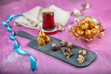 Hazelnut chocolate; Hazelnut chocolate on wooden lila background. Eid al-Fitr (Feast of Ramadan)...