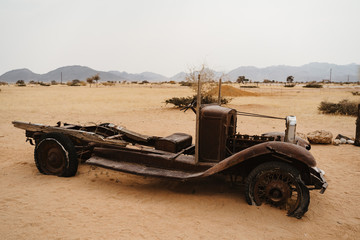 Fototapeta premium Old Timer Car Wrecks in a Desert Landscape
