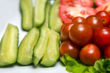 Cucumbers sliced tomatoes and lettuce