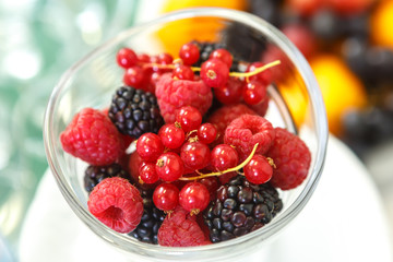 Mix of berries in a glass container