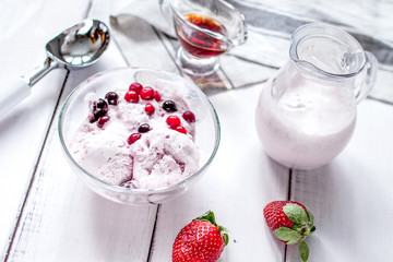organic homemade ice cream in glass bowl on wooden background