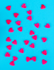 Ruby chocolate hearts on blue background