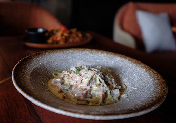 Pasta Carbonara. Spaghetti with bacon and parmesan cheese greens