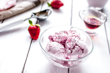 organic homemade ice cream in glass bowl on wooden background