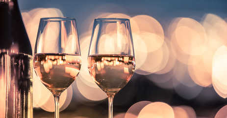 Closeup of wine glasses in a restaurant setting. 