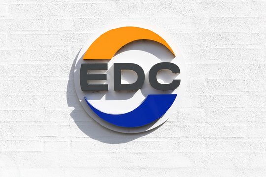 Horsens, Denmark - May 5, 2019: EDC logo on a wall. EDC is Denmark's largest and oldest real estate chain formed in 1971 with 232 independent real estate agencies