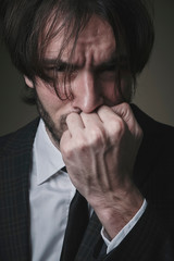 Businessman feeling really unhappy, a lot of problems