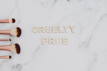 beauty industry and vegan products, make-up brushes with Cruelty free text next to them referring...