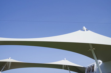 Modern design awning on cruiseship or cruise ship liner providing shadow on sun deck with clean...