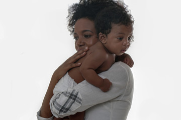portrait of african american mother holding her baby girl