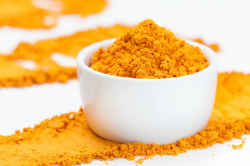 Turmeric in bowl. Selective focus.