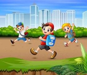 Happy boys running in the park road