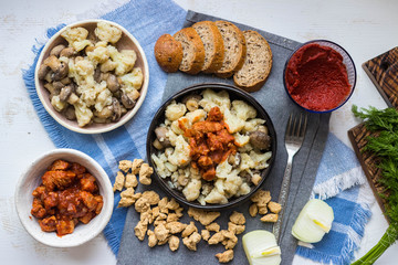 Meat substitute soy chunks with cauliflower vegan lunch food or dinner. Vegan meat with tomato paste cooked. Healthy food