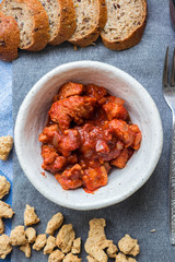 Soy meat, soy chunks with tomato paste and onion. Texturized soya meat substitute. Vegan food.