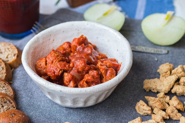 Soy meat, soy chunks with tomato paste and onion. Texturized soya meat substitute. Vegan food.