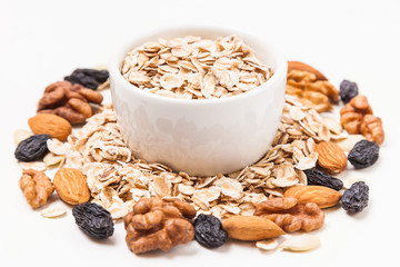 Oat flakes, nuts and raisins. Healthy eating concept.