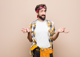 young housekeeper man feeling clueless and confused, not sure which choice or option to pick,...