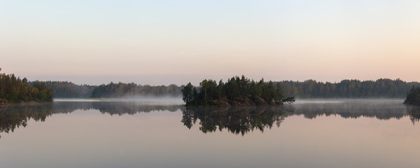 lake with fog over the water