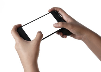 Two hands holding smart phone with blank screen in horizontal orientation and playing video games