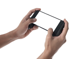 Two hands holding smart phone with blank screen in horizontal orientation and playing video games